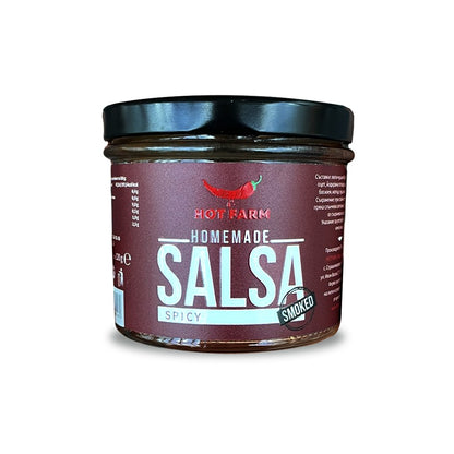 Homemade spicy smoked salsa crafted from fresh roasted chili peppers, perfect for enhancing meat dishes.