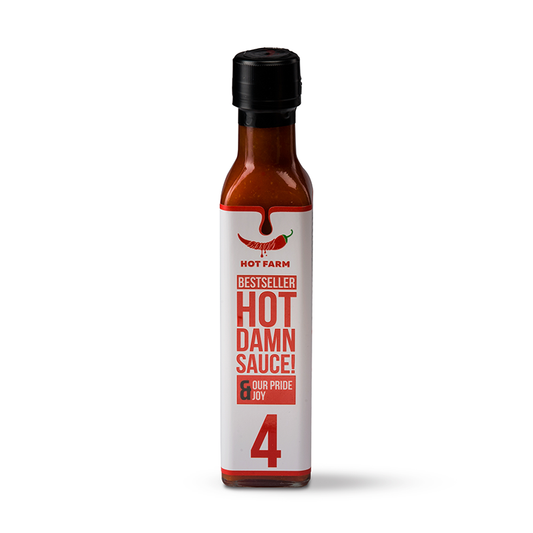 Hot Damn Sauce – Basi Sosa, a spicy Jalapeño hot sauce with balanced heat, fresh garlic aroma, and crafted from 100% natural ingredients on our farm.